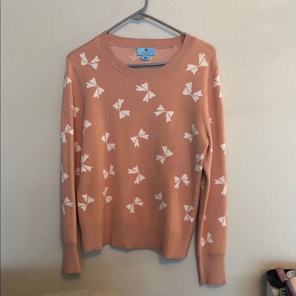 Women's Pink Sweater with White Bow Pattern